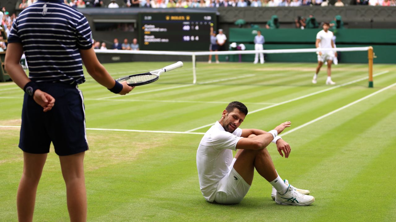 Novak Djokovic of Serbia reacts after falling in the Men's Singles Final against Carlos Alcaraz of Spain on day fourteen of The Championships Wimbledon 2023 at All England Lawn Tennis and Croquet Club on July 16, 2023 in London, England.