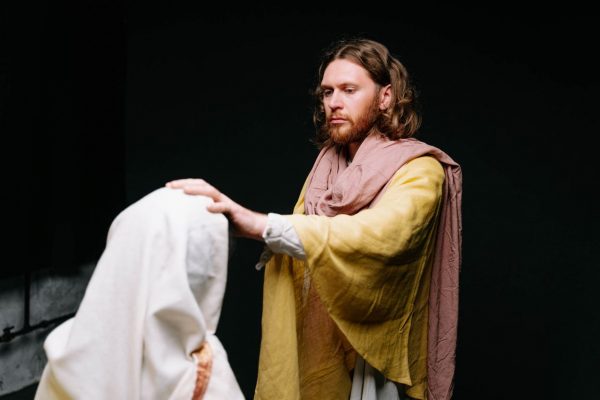A depiction of a biblical scene showing a man in robes in a spiritual act.